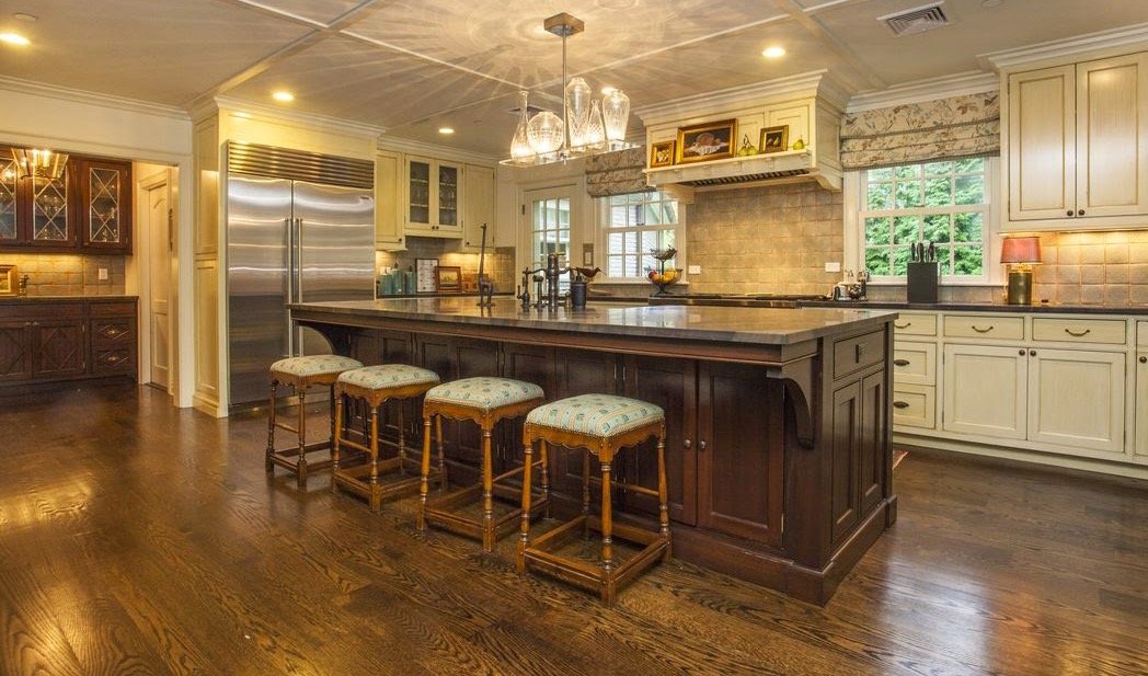 Traditional kitchen with a furniture-style island and open cookbook shelving